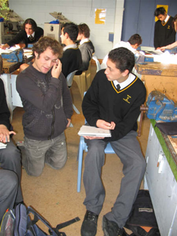 Victoria University Design School mentor in consultation with Owen Nicholson amongst the workbenches