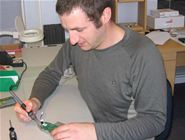 
ARANZ Medical hardware engineer Phil Barclay assembling one of the SilhouetteMobile devices.