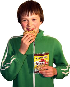 Child sampling a gluten-free CookieTime cookie