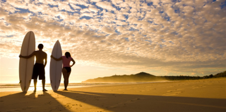 Surfers at sunset