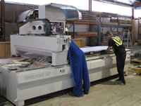 Cutting and drilling of the panels is done automatically by computer-controlled cutters on a large flat-bed machine.